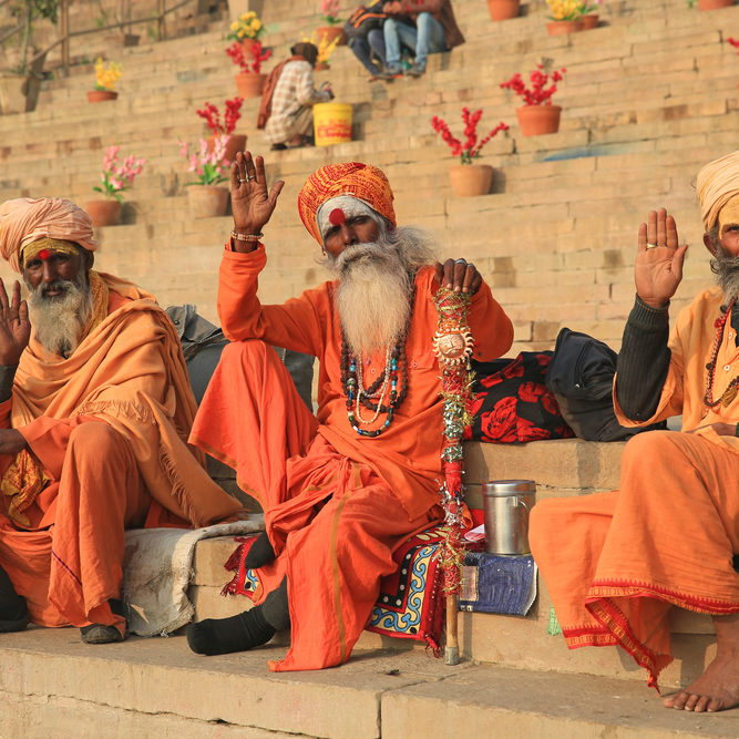Varanasi,,India,-,December,3,,2017:,Three,Hindu,Ascetics,Wave