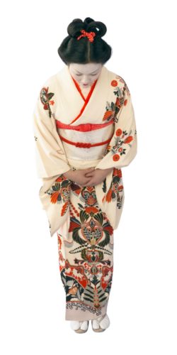 foto viaggio giappone Geisha che si inchina vestita di bianco